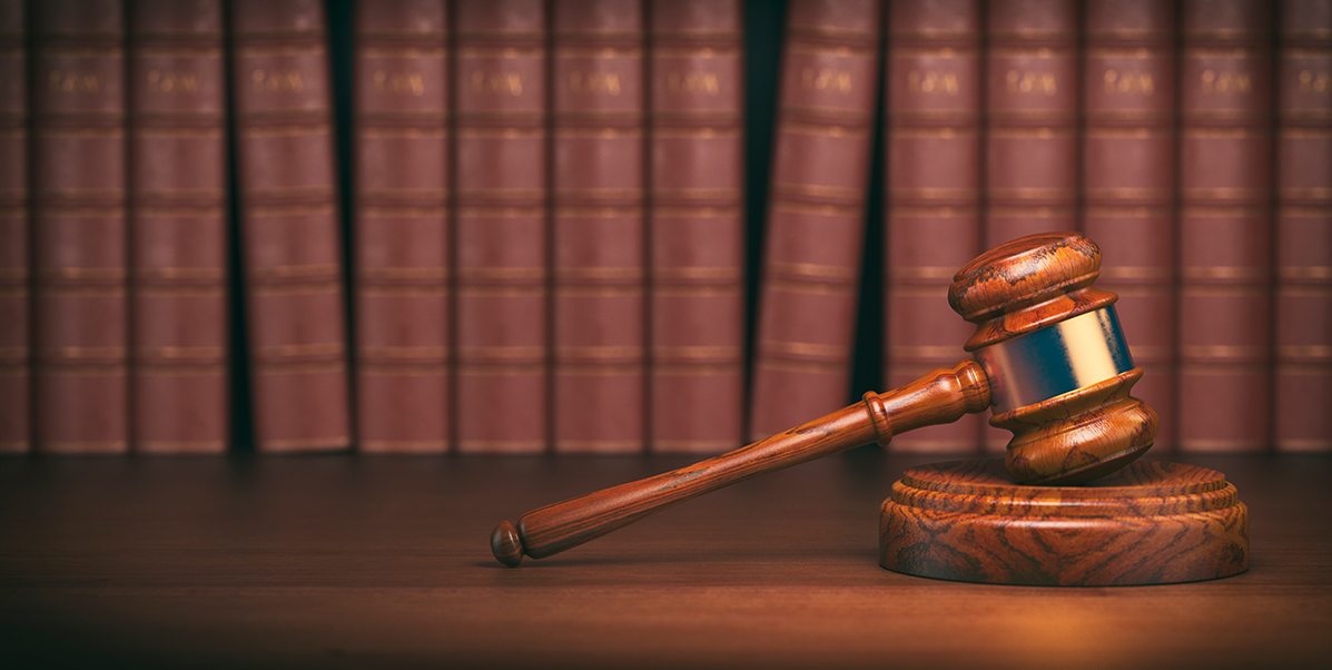gavel-on-the-background-of-vintage-lawyer-books-PLM3A57